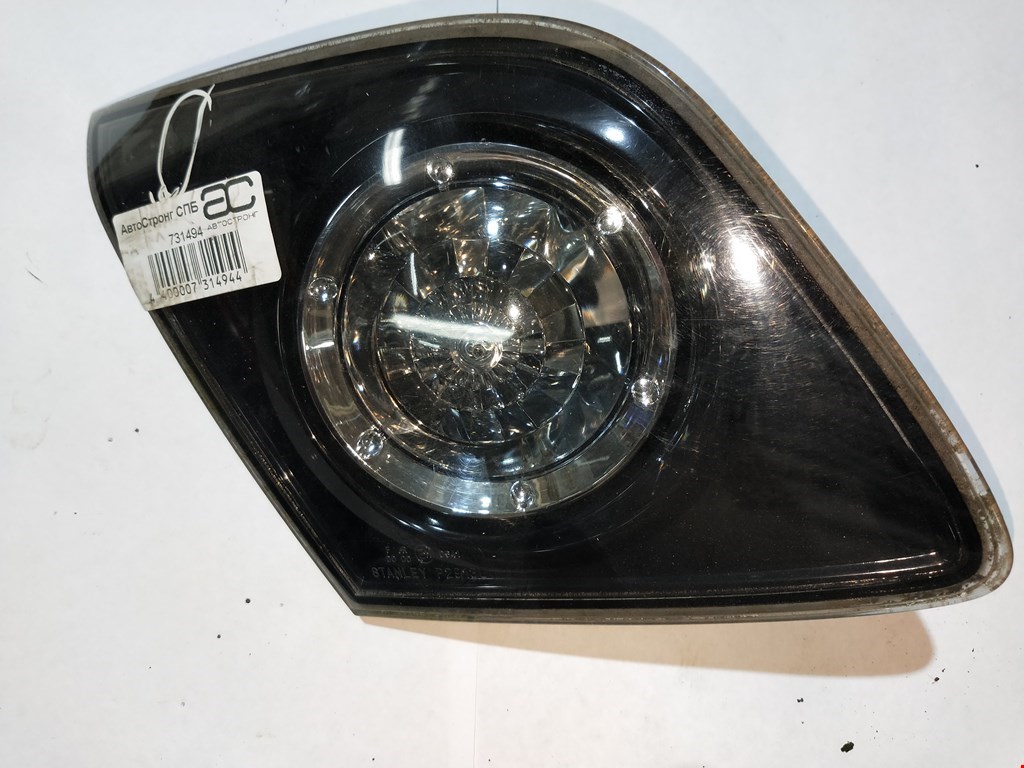 

Фонарь крышки багажника левый Mazda 3 BK, 3 BK